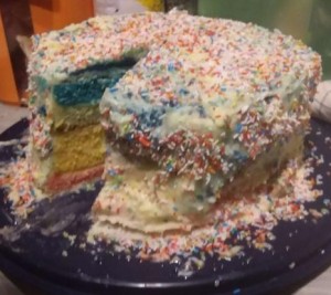 A rainbow cake my daughter and I made. We had issues with red colouring so there is no orange and a debatable purple.